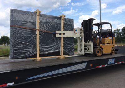 unloading equipment off of a flatbed